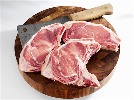 Veal chops with meat cleaver Foto de stock - Sin royalties Premium, Código: 659-03536328