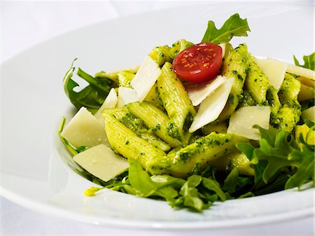 Penne with pesto, rocket and Parmesan (close-up) Stock Photo - Premium Royalty-Free, Code: 659-03536354