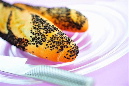 simsearch:659-03530038,k - Poppy seed baguettes on glass plate Stock Photo - Premium Royalty-Free, Code: 659-03536425