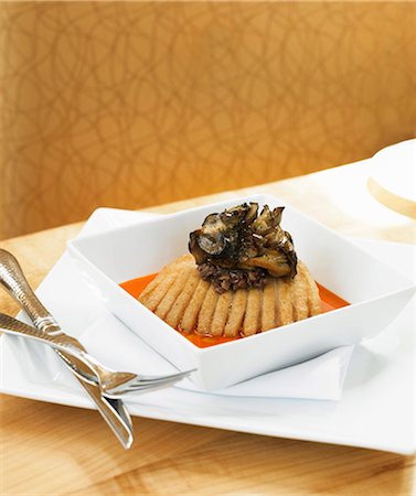 Fried Skate in Red Pepper Sauce Topped with Mushroom Stock Photo - Premium Royalty-Free, Code: 659-03536430