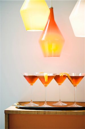 Cocktails on a Tray Under Lights Stock Photo - Premium Royalty-Free, Code: 659-03536451