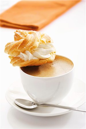 Profiterole on cup of coffee Stock Photo - Premium Royalty-Free, Code: 659-03536480