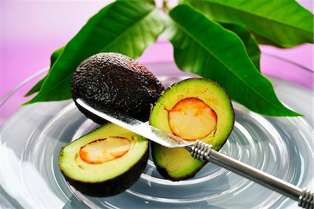 Whole and halved avocado Stock Photo - Premium Royalty-Free, Code: 659-03536555