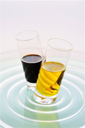 Olive oil and balsamic vinegar in two glasses Stock Photo - Premium Royalty-Free, Code: 659-03536553