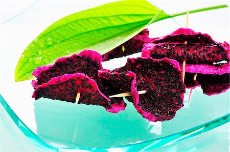 simsearch:659-03534878,k - Dried pitahaya slices on cocktail sticks Stock Photo - Premium Royalty-Free, Code: 659-03536560