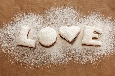 'LOVE' biscuits with icing sugar Stock Photo - Premium Royalty-Free, Code: 659-03536705