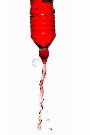 Boisson d'énergie rouge squirting de bouteille Photographie de stock - Premium Libres de Droits, Code: 659-03536727