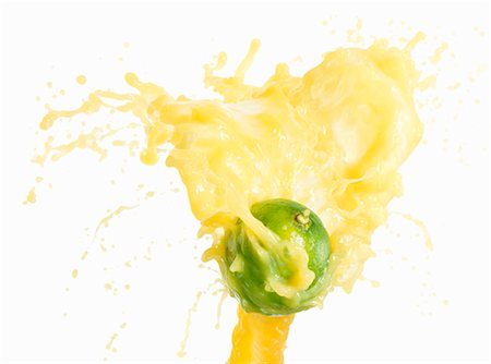 Lime with splashing lime juice Stock Photo - Premium Royalty-Free, Code: 659-03536735