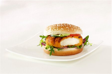 Cheeseburger with salad leaves Foto de stock - Sin royalties Premium, Código: 659-03536824
