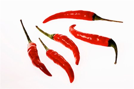 Several fresh red chillies Foto de stock - Sin royalties Premium, Código: 659-03536828