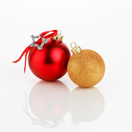 Two different Christmas baubles (red and gold) Stock Photo - Premium Royalty-Free, Code: 659-03536972