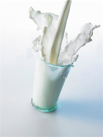 streaming (flow of movement) - Pouring milk into a glass Stock Photo - Premium Royalty-Free, Code: 659-03537019
