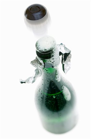 function - Cork flying out of bottle of sparkling wine Stock Photo - Premium Royalty-Free, Code: 659-03537027