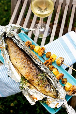 skewer bbq - Barbecued trout with mushroom and potato skewers Stock Photo - Premium Royalty-Free, Code: 659-03537205