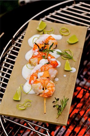 Barbecued prawn skewers with melon and lime yoghurt Stock Photo - Premium Royalty-Free, Code: 659-03537202