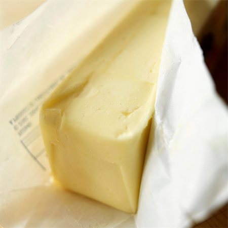 Partially Unwrapped Stick of Butter Stock Photo - Premium Royalty-Free, Code: 659-03537329