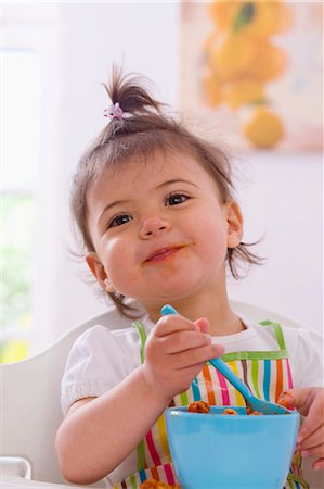 Girl eating pasta with bolognese sauce Stock Photo - Premium Royalty-Free, Code: 659-03537370
