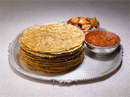 simsearch:659-01846827,k - Methi thepla (Indian flatbread) with mango pickle Stock Photo - Premium Royalty-Free, Code: 659-03537568