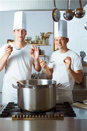 pots on a stove - Two chefs satisfied with the results of their culinary skills Stock Photo - Premium Royalty-Free, Code: 659-03537664