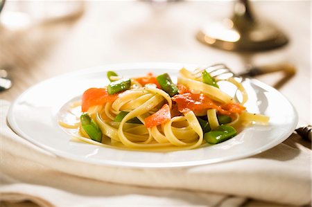 Salmon and Asparagus Pasta; On White Plate Stock Photo - Premium Royalty-Free, Code: 659-03537688