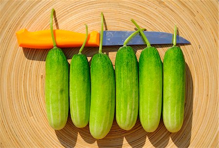 Six cucumbers with knife Stock Photo - Premium Royalty-Free, Code: 659-03537730