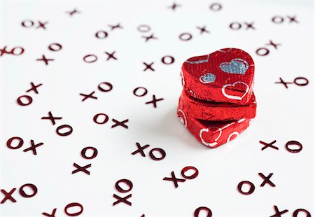 Heart-shaped chocolates in red foil Stock Photo - Premium Royalty-Free, Code: 659-03537817