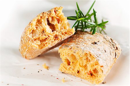 rosemary sprig - Tomato focaccia, broken, with rosemary sprig Stock Photo - Premium Royalty-Free, Code: 659-03537848