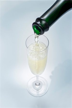 Pouring a glass of sparkling wine Stock Photo - Premium Royalty-Free, Code: 659-03530158