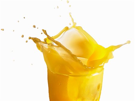 simsearch:659-07599139,k - Orange juice splashing out of a glass Stock Photo - Premium Royalty-Free, Code: 659-03530152