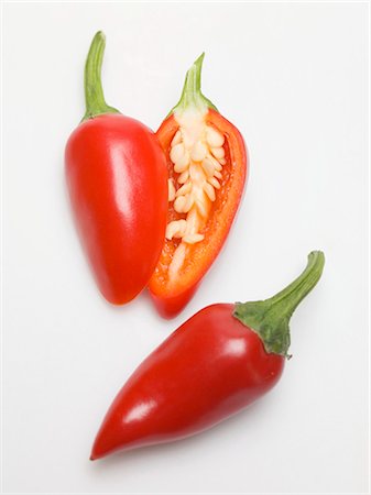 simsearch:659-03532415,k - Red chillies, whole and halved Stock Photo - Premium Royalty-Free, Code: 659-03530254