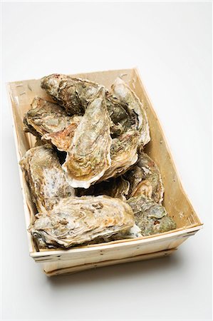 raw oyster - Fresh oysters in woodchip basket Stock Photo - Premium Royalty-Free, Code: 659-03530393