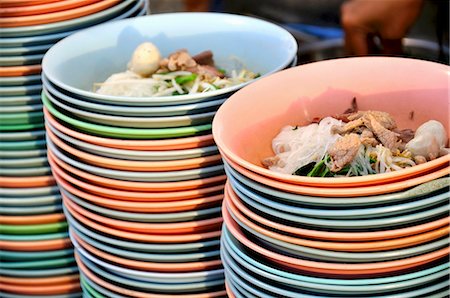 Noodle soup with meat prepared in plastic bowls (Thailand) Stock Photo - Premium Royalty-Free, Code: 659-03530421