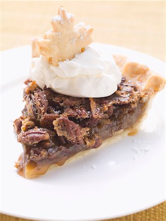 Piece of pecan pie with cream Stock Photo - Premium Royalty-Free, Code: 659-03530481