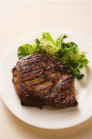 steak on grill - Grilled Steak with Side Salad Stock Photo - Premium Royalty-Free, Code: 659-03530500