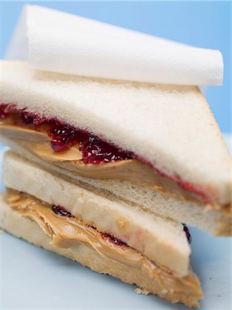 spread bread - Two peanut butter and jelly sandwiches Stock Photo - Premium Royalty-Free, Code: 659-03530526