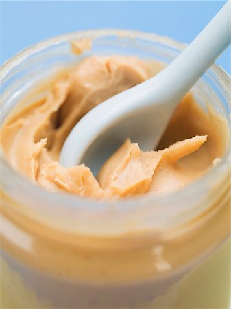 peanut butter - Peanut butter in jar with spoon (close-up) Stock Photo - Premium Royalty-Free, Code: 659-03530527