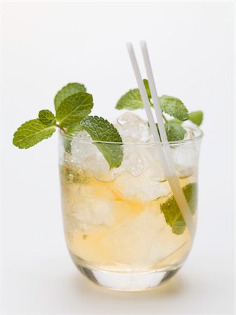 Mojito with mint, ice cubes and straws Stock Photo - Premium Royalty-Free, Code: 659-03530539