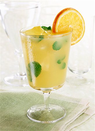 fruit juice cocktails - Mint Orange Cooler in a Glass; Orange Garnish Stock Photo - Premium Royalty-Free, Code: 659-03530565