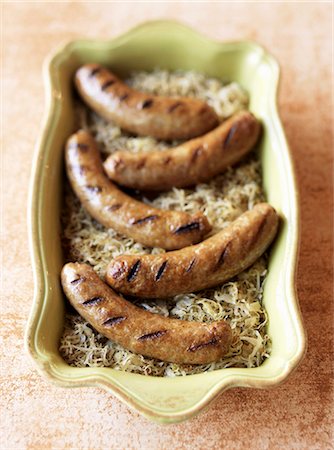 Grilled Bratwurst Over Sauerkraut Stock Photo - Premium Royalty-Free, Code: 659-03530563