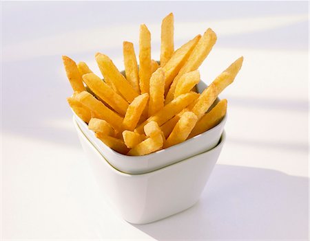 side dish - Chips in stacked pots Stock Photo - Premium Royalty-Free, Code: 659-03530602