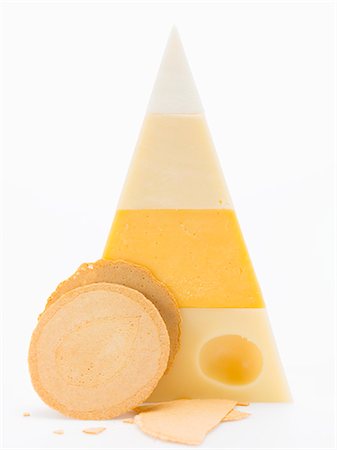 Pyramid of different cheeses, crackers Stock Photo - Premium Royalty-Free, Code: 659-03530742