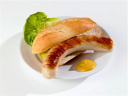 salchicha bratwurst - Grilled sausage in bread roll with mustard Foto de stock - Sin royalties Premium, Código: 659-03530793