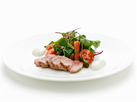 simsearch:659-01864652,k - Fillet of pork with salad Fotografie stock - Premium Royalty-Free, Codice: 659-03530969