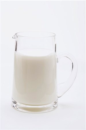 Milk in glass jug Fotografie stock - Premium Royalty-Free, Codice: 659-03531110