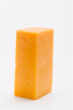 A piece of Cheddar cheese Stock Photo - Premium Royalty-Free, Code: 659-03531123