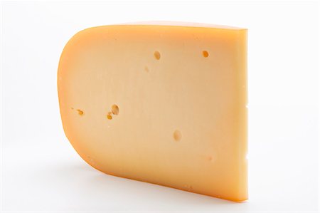 A piece of Gouda cheese Stock Photo - Premium Royalty-Free, Code: 659-03531130