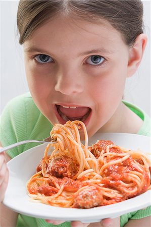 eaten - Girl eating spaghetti with meatballs Stock Photo - Premium Royalty-Free, Code: 659-03531233
