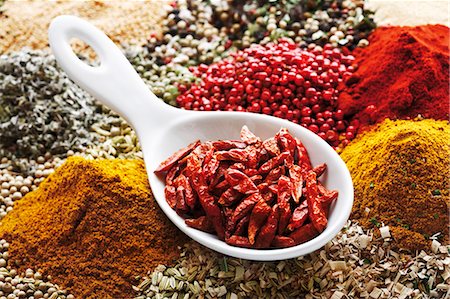 spices on spoon - Dried chillies in spoon on assorted spices Stock Photo - Premium Royalty-Free, Code: 659-03531428