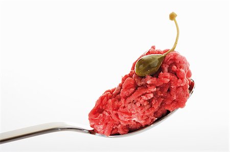 simsearch:659-09125772,k - A spoonful of raw minced beef with giant caper Stock Photo - Premium Royalty-Free, Code: 659-03531451