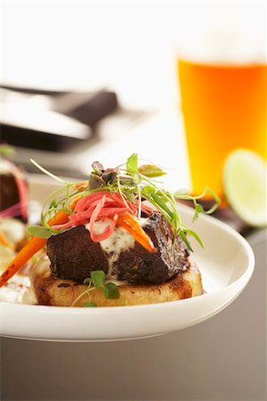 Beef ribs braised in molasses on potato Stock Photo - Premium Royalty-Free, Code: 659-03531477